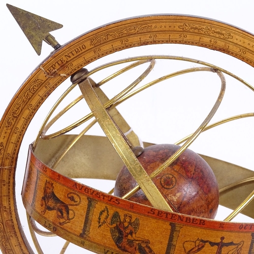 80 - A table-top brass-mounted armillary sphere, with zodiac and turned wood base, height 35cm