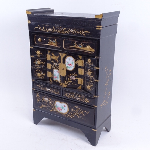 88 - A Japanese gilded black lacquer kodansu table-top jewellery cabinet, hinged lid with drawers and cab... 