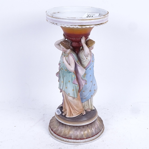 313 - A 19th century porcelain stand supported by painted figures of The Three Graces, 30cm