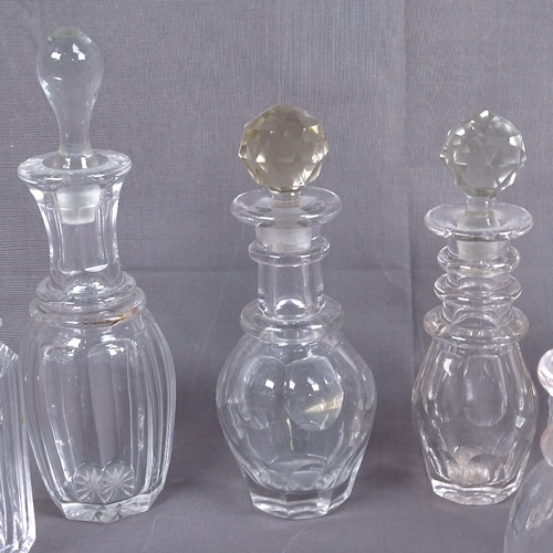 317 - A collection of Victorian and other cut-glass scent bottles and stoppers, tallest 20cm