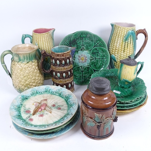 335 - Various Majolica plates, 3 Majolica sweetcorn jugs, tallest 24cm, a 19th century motto jug, and a fl... 