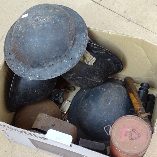 357 - Military helmets, a truncheon, binoculars etc