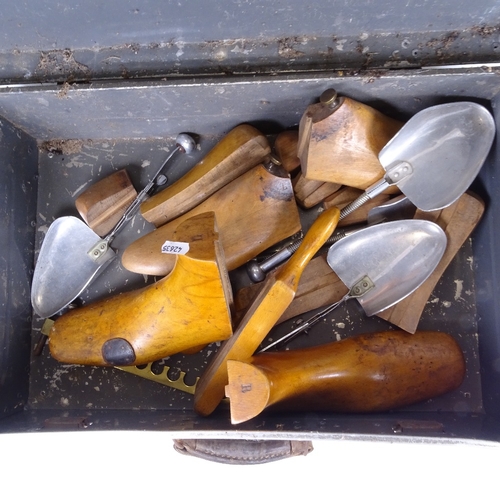 117 - A group of wooden shoe lasts, shop display stand bases etc