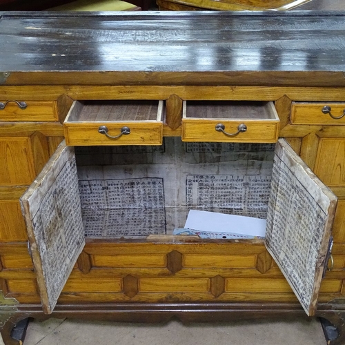 1757 - A Chinese elm side cabinet, with fitted drawers and cupboards, on scrolled feet, W92cm, H79cm, D41cm