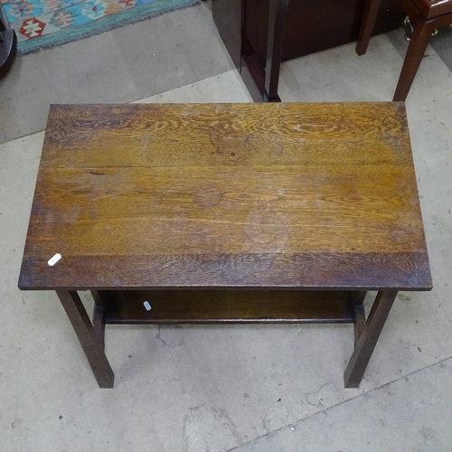 1758 - A stylised Arts and Crafts oak hall table, with pierced sides, on square tapered legs, W72cm, H73cm,... 