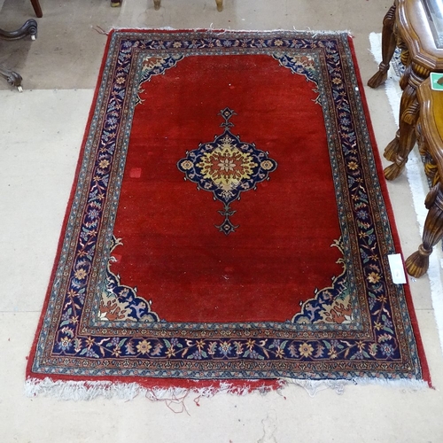 1759 - A red ground Persian design wool rug, 190cm x 140cm