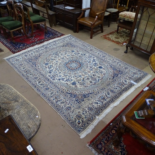 1763 - A large cream Persian Nain wool carpet, 255cm x 195cm