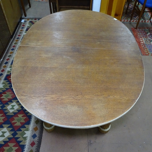 1773 - A 1920s Art Deco oval dining table, with gilt and cream base, L150cm, H77cm, D110cm (no spare leaf f... 