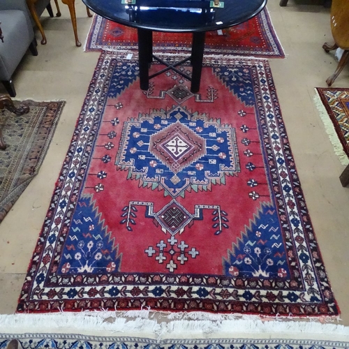 1777 - A red Shiraz wool carpet, 240cm x 156cm