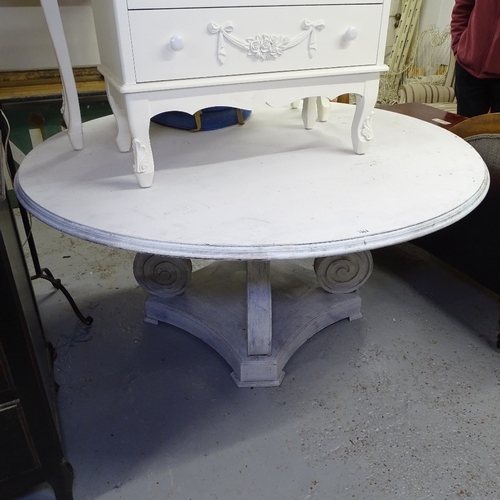 1952 - A large circular white painted dining table, on scrolled platform base, W148cm, H74cm