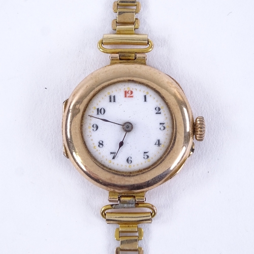 1006 - An early 20th century lady's 9ct rose gold mechanical wristwatch, white enamel dial with Arabic nume... 