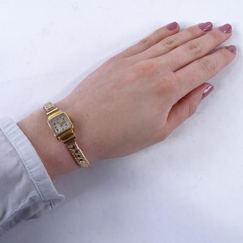 1011 - LIGHT - a lady's Vintage 18ct gold mechanical wristwatch, silvered dial with gilt eighthly Arabic nu... 