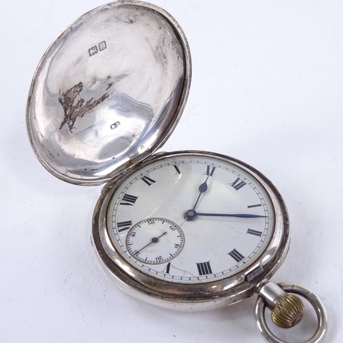 1028 - An early 20th century silver full hunter pocket watch, white enamel dial with black Roman numeral ho... 