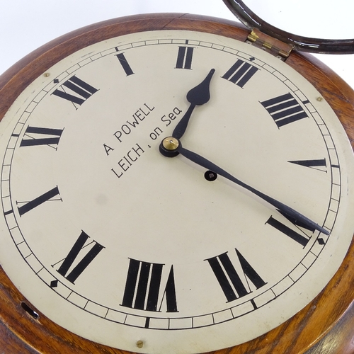 1045 - An early 20th century oak-cased circular dial wall clock, by A Powell of Leich-on-Sea, silvered dial... 