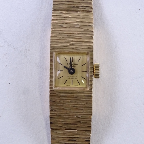 1050 - DELVINA - a lady's Vintage 9ct gold mechanical wristwatch, gilt dial with baton hour markers, blued ... 