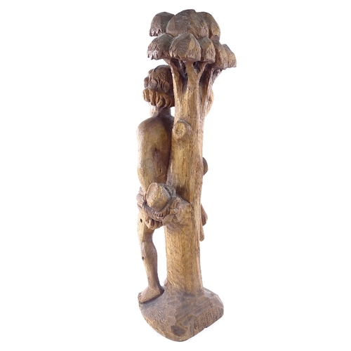104 - A carved wood figure of St Sebastian tied to a tree, 17th/18th century, all carved from one section ... 