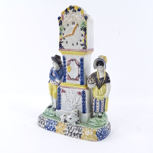 109 - A rare Yorkshire Pratt Ware longcase clock group moneybox, flanked by a pair of figures and a dog in... 