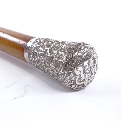 132 - A 19th century malacca walking cane, with Indian floral embossed silver top, length 92cm.
