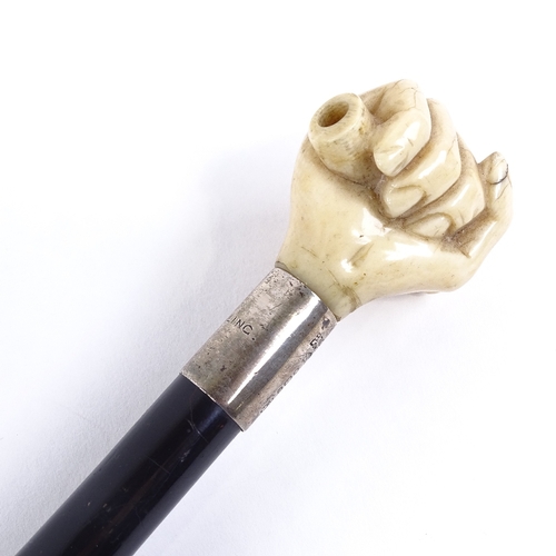 133 - A 19th century ebony walking cane, with marine ivory clenched fist knop and silver collar, by Briggs... 