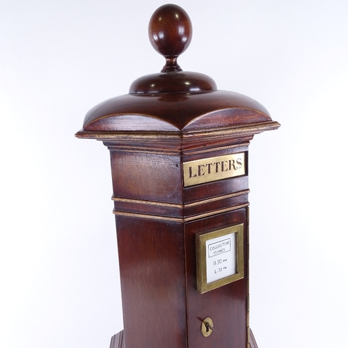 135 - A vintage mahogany country-house post box, with applied mouldings, brass mounts and ball finial, hei... 