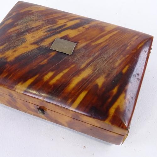 142 - A 19th century tortoiseshell box, on ivory feet, 10cm x 7cm.
