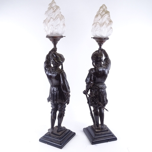 144 - A pair of Victorian spelter figural lamps, with original frosted glass flaming torch shades, overall... 