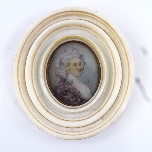 68 - A Georgian miniature watercolour on ivory, portrait of a lady with powdered hair, unsigned in moulde... 