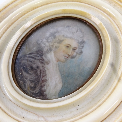 68 - A Georgian miniature watercolour on ivory, portrait of a lady with powdered hair, unsigned in moulde... 