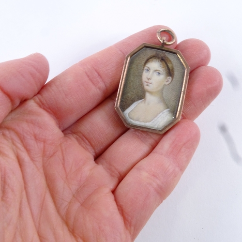 71 - A Georgian miniature watercolour on ivory, portrait of a young lady, unmarked gold pendant frame, fr... 