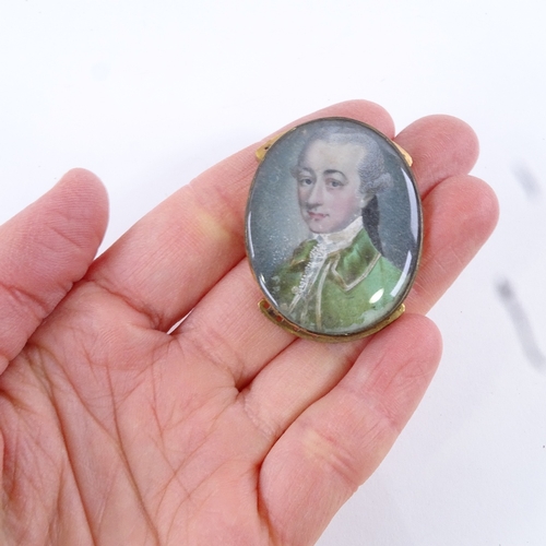 72 - A Georgian miniature watercolour on ivory, head and shoulders portrait of a gentleman wearing a gree... 