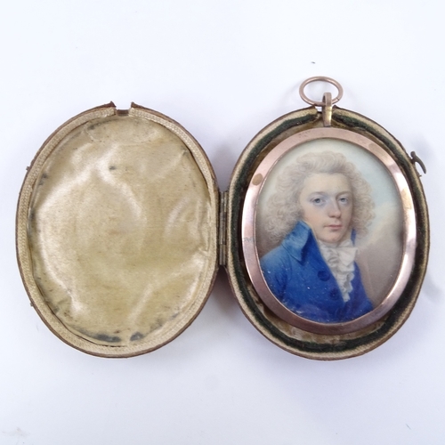 77 - A Georgian miniature watercolour on ivory, portrait of a gentleman wearing a blue coat with frilled ... 