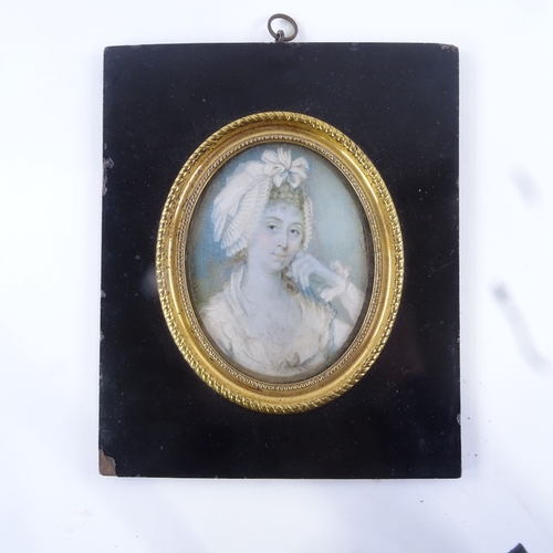 78 - A 19th century miniature watercolour on ivory, head and shoulders portrait of a lady wearing a frill... 