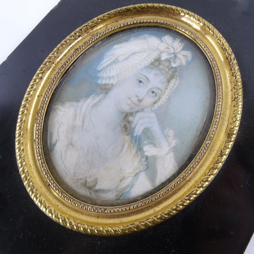 78 - A 19th century miniature watercolour on ivory, head and shoulders portrait of a lady wearing a frill... 
