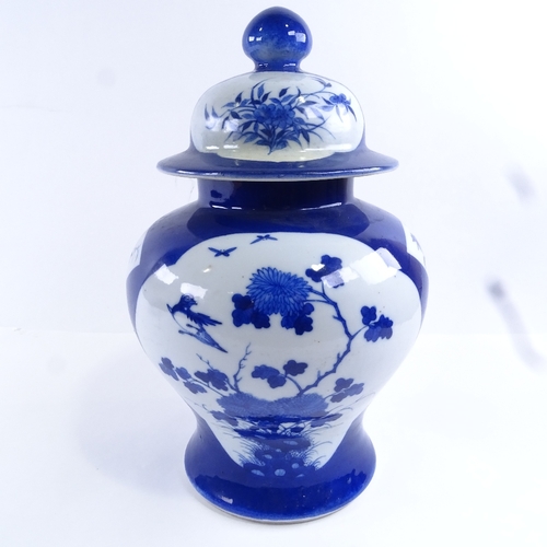 86 - A Chinese blue and white porcelain jar and cover, hand painted bird and prunus decoration, height 32... 