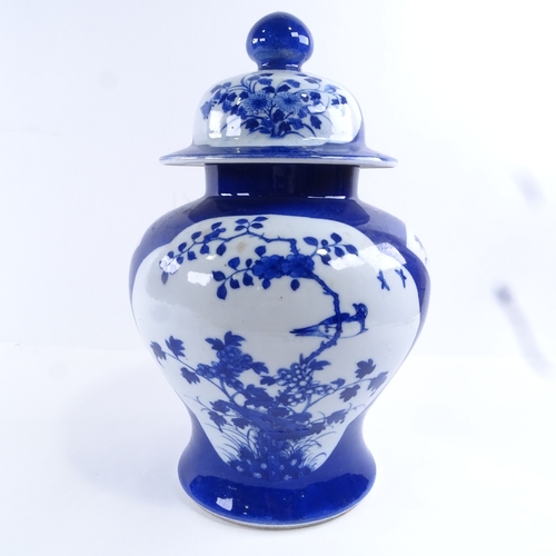 86 - A Chinese blue and white porcelain jar and cover, hand painted bird and prunus decoration, height 32... 