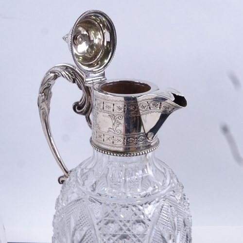 95 - An Edwardian cut glass and silver mounted Claret jug, hallmarks Birmingham 1908, height 28cm.