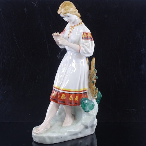 171 - A Russian porcelain figure of a girl, height 29cm