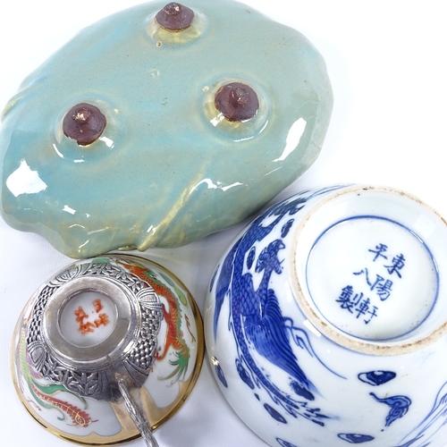 184 - A group of Oriental items, including a porcelain lotus leaf dish with frog mount, length 19cm, a blu... 