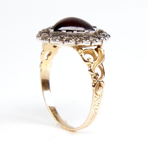 1103 - A Georgian unmarked gold heart-shaped cabochon garnet and rose-cut diamond cluster ring, pierced scr... 