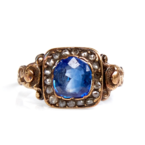 1105 - A Georgian unmarked gold sapphire and rose-cut diamond cluster ring, scrollwork shoulders with ribbe... 