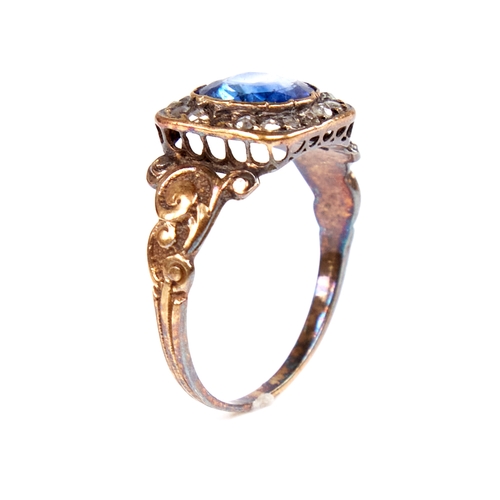 1105 - A Georgian unmarked gold sapphire and rose-cut diamond cluster ring, scrollwork shoulders with ribbe... 