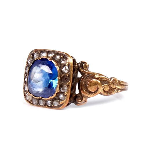 1105 - A Georgian unmarked gold sapphire and rose-cut diamond cluster ring, scrollwork shoulders with ribbe... 