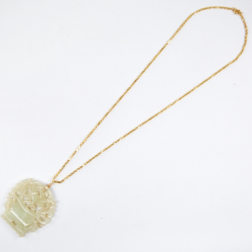 1106 - A Chinese carved and pierced jade basket of flowers pendant necklace, on a Chinese high carat gold f... 