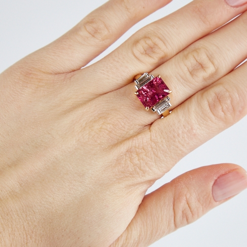 1109 - A modern unmarked gold rubellite tourmaline and baguette-cut diamond ring, set with emerald-cut rube... 