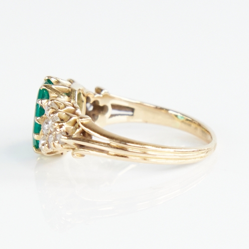 1110 - An early 20th century unmarked gold emerald and diamond cluster ring, set with octagonal step-cut em... 