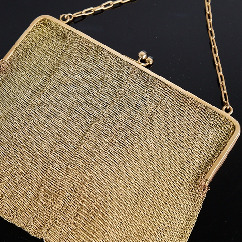 1112 - An Art Deco 9ct gold mesh evening bag/purse, 9ct cable link handle suspending a 9ct frame with caboc... 