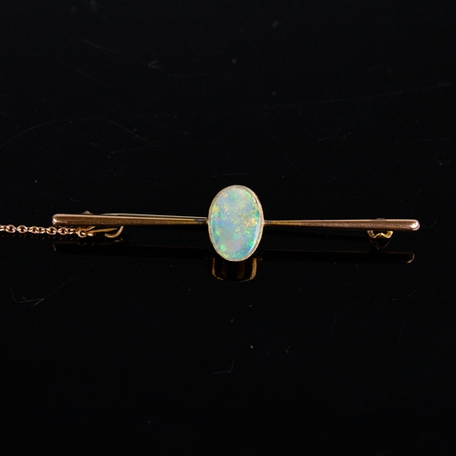 1114 - An early 20th century 9ct gold cabochon opal bar brooch, opal dimensions: length - 11.70mm, width - ... 