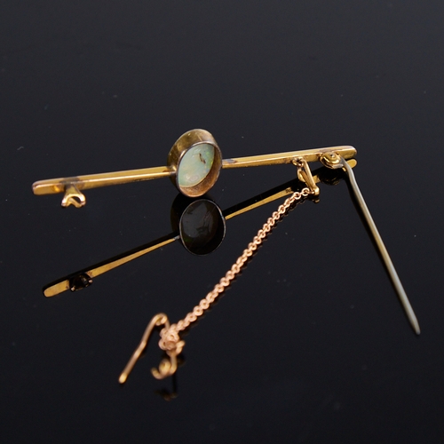 1114 - An early 20th century 9ct gold cabochon opal bar brooch, opal dimensions: length - 11.70mm, width - ... 