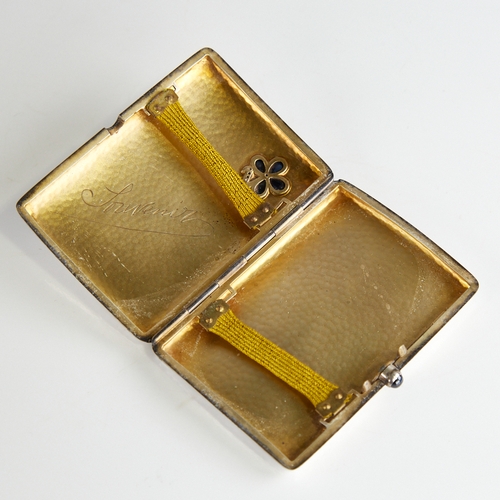 1116 - An early 20th century Continental silver curved cigarette case, floral design set with pear-shaped c... 