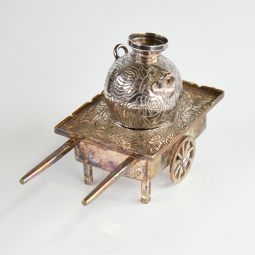 1117 - A 20th century Egyptian miniature silver cart and amphora, engraved foliate decoration, cart length ... 